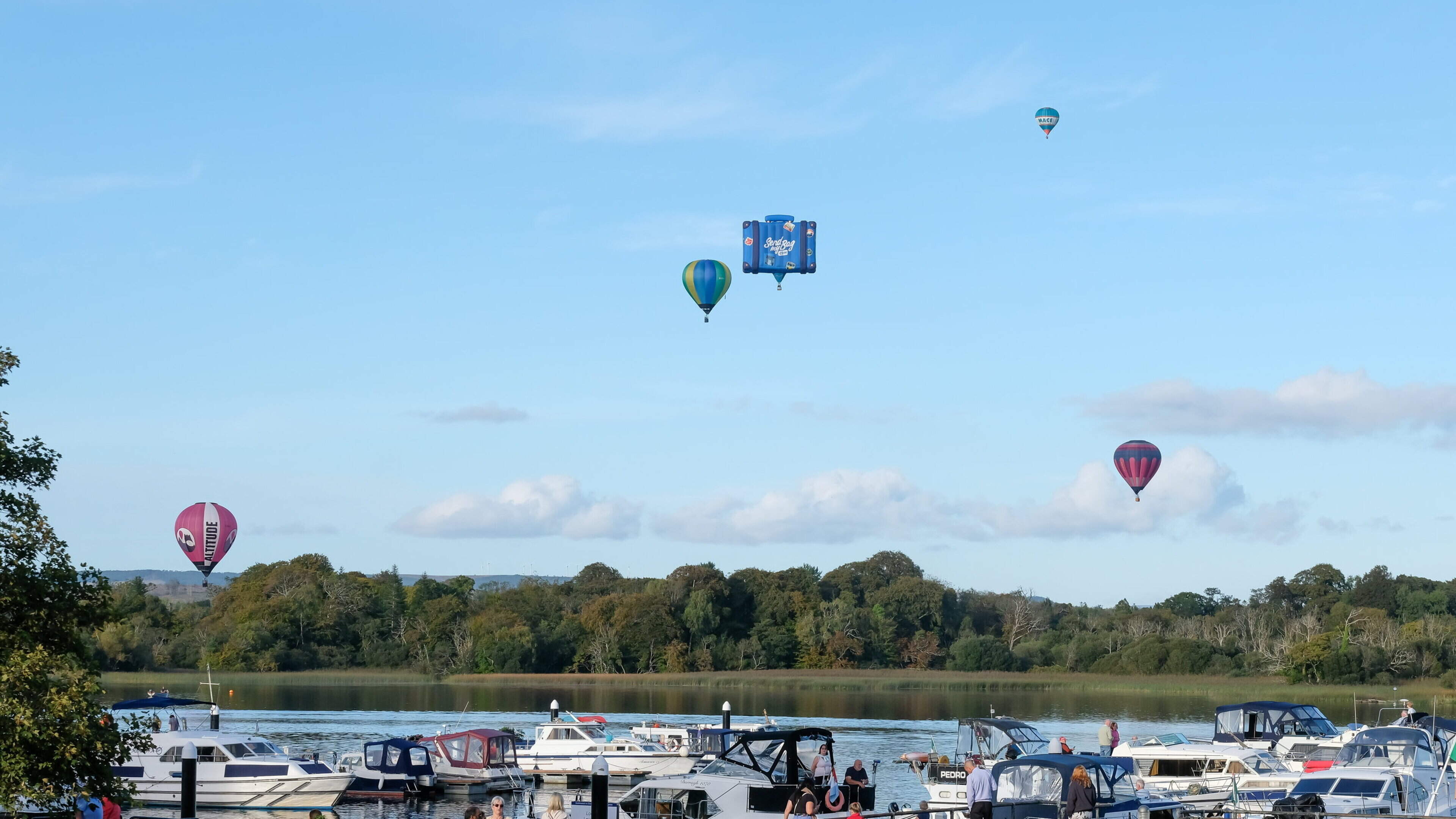Eye-catching ‘Flying Suitcase’ balloon delights spectators on its world-record tour over Lough Key in Boyle